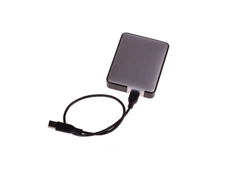 Portable external hard disk drive with USB cable isolated on white background. 