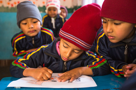 KATHMANDU, NEPAL - DEC 24: Unknown pupils in English class at primary school, Dec 24, 2013 in Kathmandu, Nepal. Only 50% of  children in Nepal can reach 5 grade.のeditorial素材