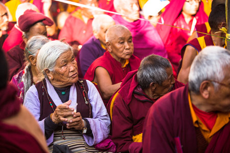 KHATMANDU, NEPAL - DEC 15, 2013: Unidentified tibetan Buddhist monks near stupa Boudhanath during festive Puja of H.H. Drubwang Padma Norbu Rinpoche's reincarnation's.のeditorial素材