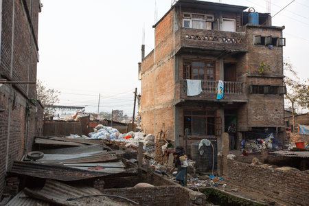 KATHMANDU, NEPAL - DEC 19, 2013: Unidentified people from poorer areas working in sorting of plastic on the dump. Only 35% of population have access to adequate sanitation.のeditorial素材