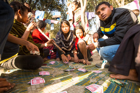 KATHMANDU, NEPAL - DEC 16, 2013: Unidentified poor people near their houses at slums in Tripureshwor district, Kathmandu. Caste of untouchables in Nepal, is about 7 % of population.のeditorial素材