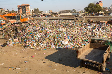 KATHMANDU, NEPAL - DEC 22, 2013: Unidentified people from poorer areas working in sorting of plastic...