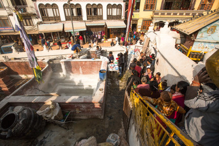 KHATMANDU, NEPAL - DEC 17, 2013: Unidentified Buddhist pilgrims near stupa Boudhanath during festive solemn Puja of H.H. Drubwang Padma Norbu Rinpoche's reincarnation's.のeditorial素材