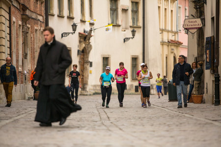 KRAKOW, POLAND - MAR 23, 2014: Unidentified participants during the annual Krakow  international Marathon. Krakow Marathon conducted since 2002 under the slogan: With history in the background.のeditorial素材