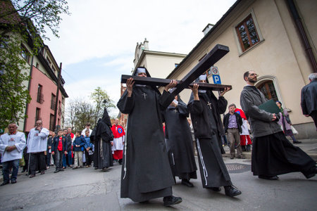 KRAKOW, POLAND - APR 18, 2014: Unidentified participants of the Way of the Cross on Good Friday...