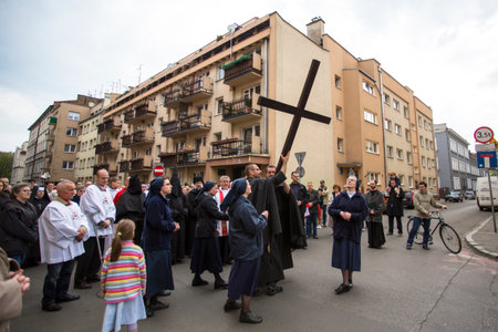 KRAKOW, POLAND - APR 18, 2014: Unidentified participants of the Way of the Cross on Good Friday...
