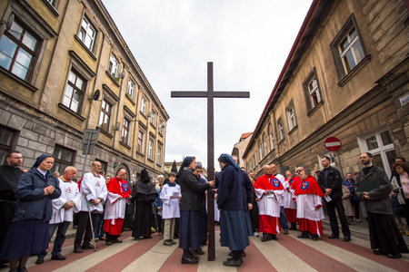 KRAKOW, POLAND - APR 18, 2014: Unidentified participants of the Way of the Cross on Good Friday celebrated at the historic center of Krakow.のeditorial素材