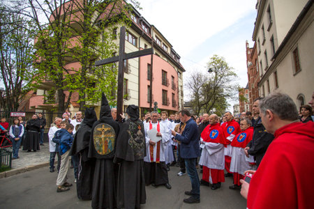 KRAKOW, POLAND - APR 18, 2014: Unidentified participants of the Way of the Cross on Good Friday celebrated at the historic center of Krakow.のeditorial素材
