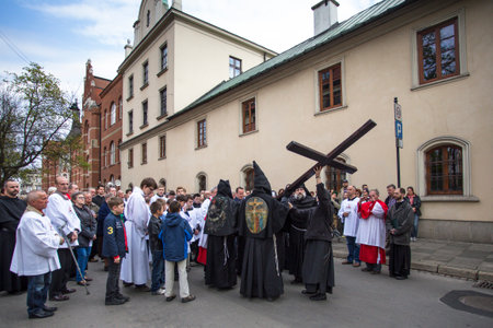 KRAKOW, POLAND - APR 18, 2014: Unidentified participants of the Way of the Cross on Good Friday...