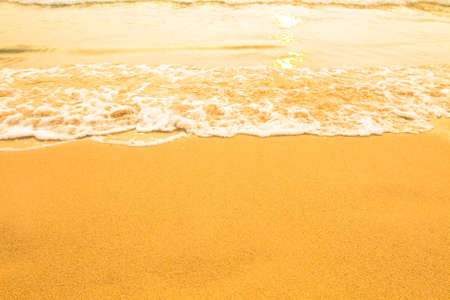 Beach sand texture, soft wave of the sea.の写真素材