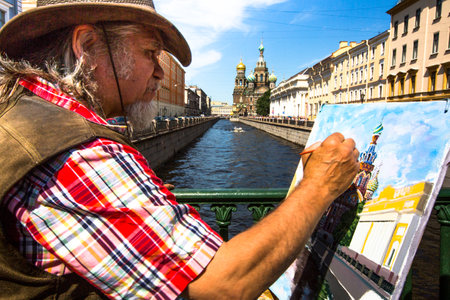 ST.PETERSBURG, RUSSIA - JUNE 22: Unknown artist paints the Church of the Savior on Spilled Blood, June 22, 2013, St. Petersburg, Russia. Church is one of the main sights of St.Petersburg, was built 1883-1907.のeditorial素材