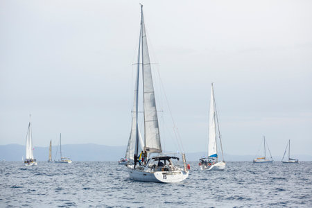 AEGEAN SEA, GREECE - APR 27, 2014: Unidentified sailboats participate in sailing regatta 11th Ellada...