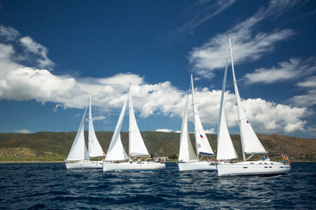 AEGEAN SEA, GREECE - MAY 4, 2014: Unidentified sailboats participate in sailing regatta "11th Ellada 2014" on Aegean Sea.のeditorial素材