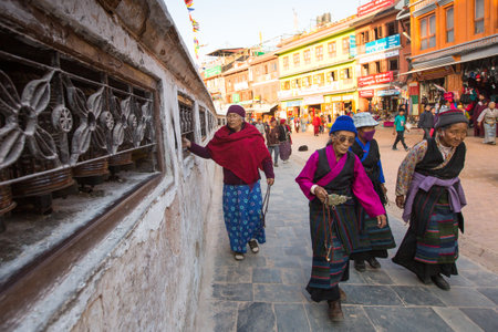 KATHMANDU, NEPAL - DEC 3: Unidentified pilgrims circle stupa Boudhanath, Dec 3, 2013 in Kathmandu, Nepal. Ancient Stupa is one of the largest in the world, of 1979 is a UNESCO World Heritage Site.のeditorial素材