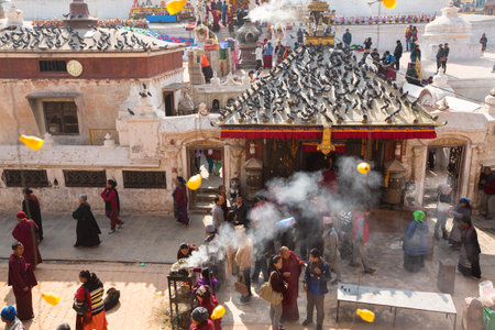 KHATMANDU, NEPAL - DEC 17: Unidentified Buddhist pilgrims near stupa Boudhanath during festive solemn Puja of H.H. Drubwang Padma Norbu Rinpoche's reincarnation's, Dec 17, 2013 in Khatmandu, Nepal.のeditorial素材