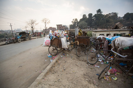 KATHMANDU, NEPAL - DEC 19: Pile of domestic garbage in carts, bicycles, Dec 19, 2013 in Kathmandu, Nepal. Only 35% population of Nepal have access to adequate sanitation.のeditorial素材