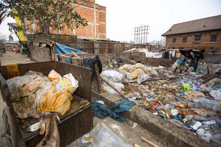 KATHMANDU, NEPAL - DEC 19: Unidentified people from poorer areas working in sorting of plastic on the dump, Dec 19, 2013 in Kathmandu, Nepal. Only 35% of population have access to adequate sanitation.のeditorial素材