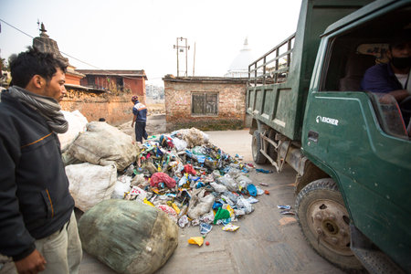 KATHMANDU, NEPAL - DEC 19: Unidentified people from poorer areas working in sorting of plastic on the dump, Dec 19, 2013 in Kathmandu, Nepal. Only 35% of population have access to adequate sanitation.のeditorial素材