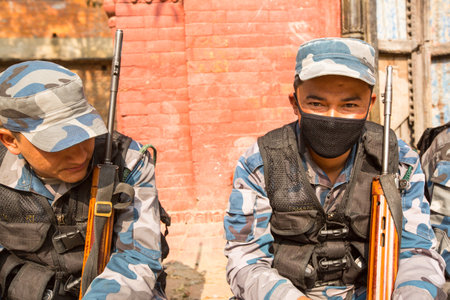 KATHMANDU, NEPAL - Oct 19: Unknown nepalese soldiers Armed Police Force near public school, Dec 19, 2013 in Kathmandu, Nepal. Initially founded with a roster of 15,000 police and military personnel.のeditorial素材