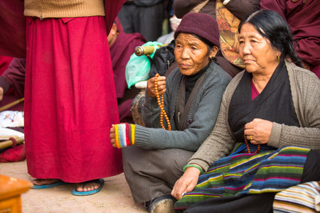 KHATMANDU, NEPAL - DEC 17: Unidentified Buddhist pilgrims near stupa Boudhanath during festive solemn Puja of H.H. Drubwang Padma Norbu Rinpoche's reincarnation's, Dec 17, 2013 in Khatmandu, Nepal.のeditorial素材