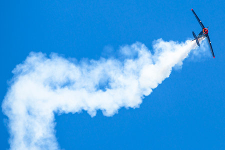 BERLIN, GERMANY - MAY 20, 2014: The aircraft Red Bull Noorduyn AT-16 D-FHGK demonstration during the International Aerospace Exhibition ILA Berlin Air Show-2014.のeditorial素材
