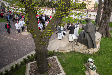 KRAKOW, POLAND - APR 18, 2014: Unidentified participants of the Way of the Cross on Good Friday...