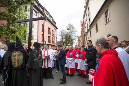 KRAKOW, POLAND - APR 18, 2014: Unidentified participants of the Way of the Cross on Good Friday...