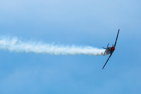 BERLIN, GERMANY - MAY 20, 2014: The aircraft Red Bull Noorduyn AT-16 D-FHGK demonstration during the International Aerospace Exhibition ILA Berlin Air Show-2014.のeditorial素材