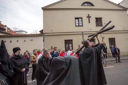 KRAKOW, POLAND - APR 18, 2014: Unidentified participants of the Way of the Cross on Good Friday celebrated at the historic center of Krakow.のeditorial素材