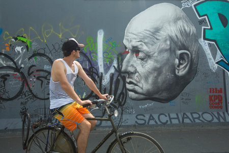 BERLIN, GERMANY - MAY 23, 2014: Fragment of graffiti on Berlin Wall at East Side Gallery - it's a...
