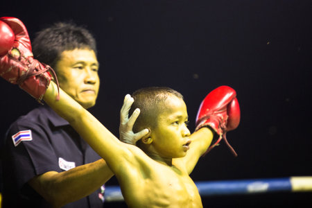 CHANG, THAILAND - FEB 22: Unidentified young Muaythai fighter in ring during match, Feb 22, 2013 on Chang, Thailand.For many Thai men, is only way to break out of poverty, per battle pay to 7000 baht.のeditorial素材