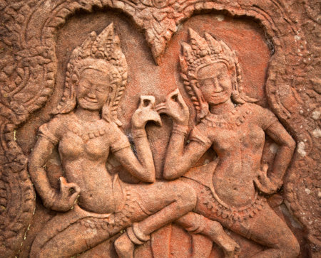 SIEM REAP, CAMBODIA - DEC 13: Apsaras - khmer stone carving in Angkor Wat, Dec 13, 2012 on Siem Reap, Cambodia. Angkor is the country's prime attraction for visitors.のeditorial素材