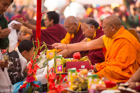 KHATMANDU, NEPAL - DEC 17: Unidentified tibetan Buddhist monks near stupa Boudhanath during festive Puja of H.H. Drubwang Padma Norbu Rinpoche's reincarnation's, Dec 17, 2013 in Khatmandu, Nepal.のeditorial素材