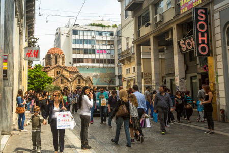 ATHENS, GREECE - MAY 10, 2014: Athenians and tourists in center of city. Tourism is a decisive sector of hope for Greek economy - In the year Greece receives about 18 million tourists.のeditorial素材