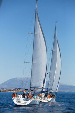AEGEAN SEA, GREECE - MAY 8, 2014: Unidentified sailboats participate in sailing regatta "11th Ellada 2014" on Aegean Sea.のeditorial素材