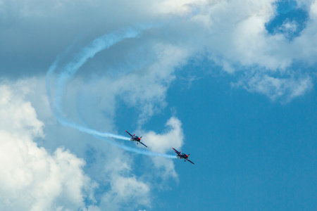 BERLIN, GERMANY - MAY 21, 2014: A Extra-300, D-EAXK- two-seat aerobatic plane (Germany), demonstration during the International Aerospace Exhibition ILA Berlin Air Show-2014.のeditorial素材