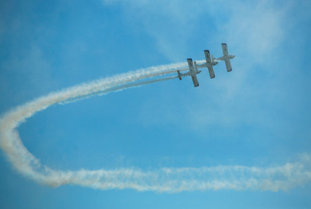 BERLIN, GERMANY - MAY 21, 2014: Aerobatic team 3x Fly Sinthesis Texan Top Class (Wefly team, Italy)...