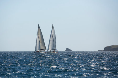 AEGEAN SEA, GREECE - APR 29, 2014: Unidentified sailboats participate in sailing regatta "11th Ellada 2014" on Aegean Sea.のeditorial素材