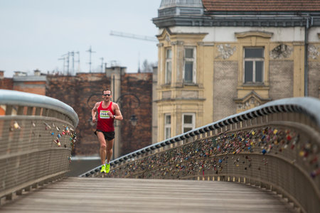 KRAKOW, POLAND - MAR 23, 2014: Unidentified participants during the annual Krakow international Marathon. Krakow Marathon conducted since 2002 under the slogan: With history in the background.のeditorial素材