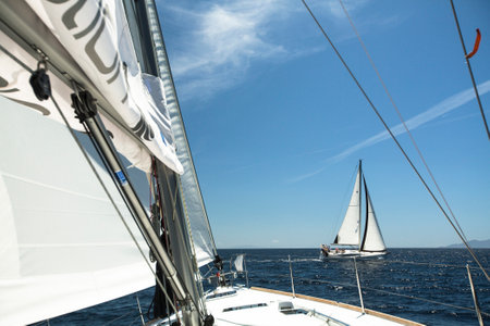 AEGEAN SEA, GREECE - APR 29, 2014: Unidentified sailboats participate in sailing regatta "11th Ellada 2014" on Aegean Sea.のeditorial素材