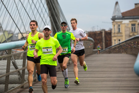 KRAKOW, POLAND - MAR 23, 2014: Unidentified participants during the annual Krakow international Marathon. Krakow Marathon conducted since 2002 under the slogan: With history in the background.のeditorial素材