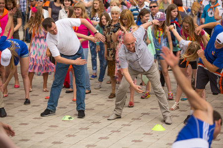 TIKHVIN, RUSSIA - JULY 5, 2014: Head of Tikhvin region Alexander Lazarevich (R) and acting head of administration Tikhvin district Alexander Timkov (L) agitate people to sports during celebration Day of city Tikhvin (631 year)のeditorial素材