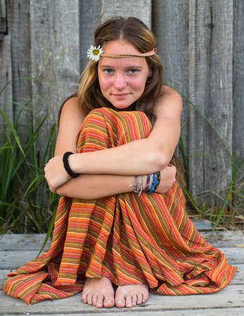 Young lovely hippie girl outdoors in village.の写真素材