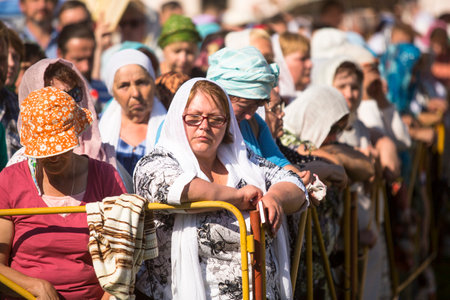 TIKHVIN, RUSSIA - JULY 9, 2014: Unidentified participants Orthodox divine Liturgy on the occasion celebrations of the 10th anniversary of the return of the Tikhvin icon of the Mother of God.のeditorial素材