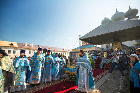 TIKHVIN, RUSSIA - JULY 9, 2014: Unidentified participants Orthodox divine Liturgy on the occasion...