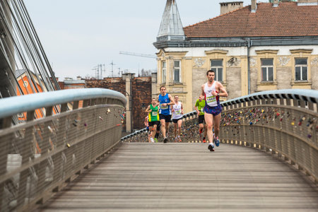 KRAKOW, POLAND - MAR 23, 2014: Unidentified participants during the annual Krakow international Marathon. Krakow Marathon conducted since 2002 under the slogan: With history in the background.のeditorial素材