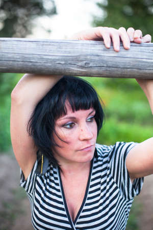 Nice young brunette woman in the village.