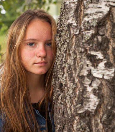 Pretty young girl in the birch forest.の写真素材
