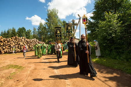 KRASNY BRONEVIK, RUSSIA - JULY 7, 2014: Celebrations commemorating the Rev. Anthony Dymsky (died 1224) in Antony Dymsky Monastery - Procession on Lake Dymsky, the great blessing of water and bathing.のeditorial素材