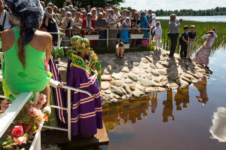 KRASNY BRONEVIK, RUSSIA - JULY 7, 2014: Celebrations commemorating the Rev. Anthony Dymsky (died 1224) in Antony Dymsky Monastery - Procession on Lake Dymsky, the great blessing of water and bathing.のeditorial素材